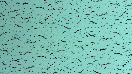Water green surface displays a speckled texture of black spots and streaks in high resolution photo