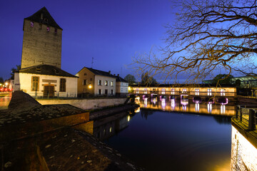 Barrage Vauban illuminated at dusk in Strasbourg