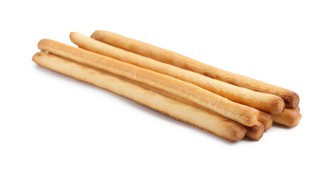 Many delicious grissini sticks isolated on white