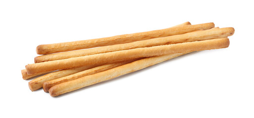 Many delicious grissini sticks isolated on white