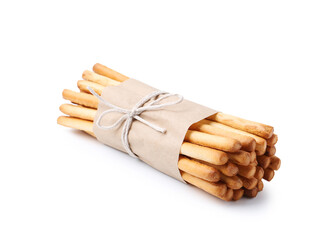 Many delicious grissini sticks isolated on white