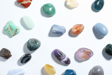 Aura. Different natural mineral stones on white background, flat lay