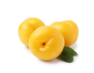Yellow cherry plums with leaves isolated on white