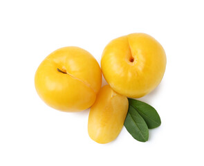Whole and cut yellow cherry plums isolated on white, top view