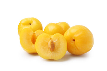 Whole and cut yellow cherry plums isolated on white
