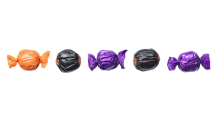 Halloween candies in orange, black, and purple wrappers isolated on transparent background