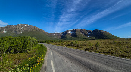 Rural Landscape With Abandoned Road And Snowy Mountains On Lofoten Islands In Norway