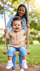 Mother and child playing on a swing set in a park
