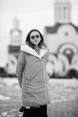 Obraz premium Portrait of a young beautiful long-haired girl outdoors in winter.
