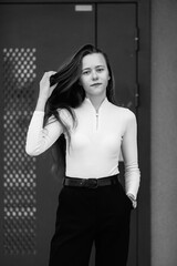 Portrait of a young beautiful long-haired girl outdoors in winter.