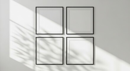 Four square black frames mockup with sunlight shadow on white wall
