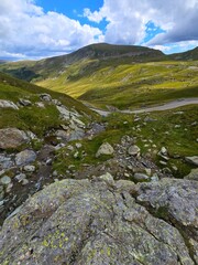 Looking down on the Transalpina Road from the height of the Carbunele waterfall on a beautiful summer day. Valcea, Romania