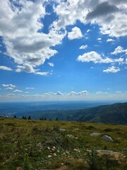Fototapeta premium Beautiful panoramic view from the Transalpina Road in the Carpathian Mountains on a beautiful summer day. Valcea, Romania