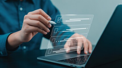 Person ticking off tasks on digital checklist using stylus and laptop, achieving goals