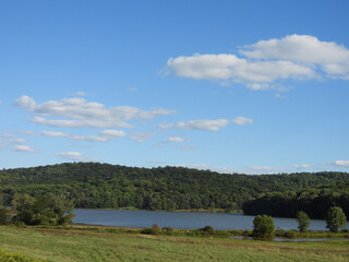 Obraz premium The picturesque scenery of the wilderness that surrounds the lake, nestled within the Middle Creek Wildlife Management Area, Lancaster County, Pennsylvania.