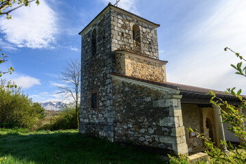 Naklejka premium Bell tower of San Adrian Martir church in Villalbeto Palencia