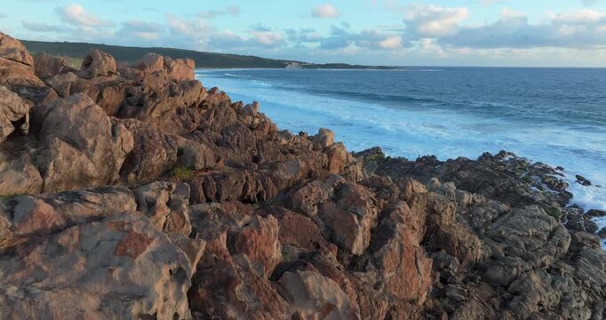 4k Aerial views of rugged rocky coastline in South West Australia at sunset