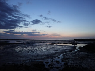 Moored Boat at low tide at twilight
