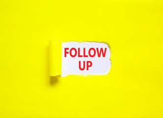 Follow up symbol. Concept word Follow up on beautiful white paper. Beautiful yellow paper background. Business follow up concept. Copy space.