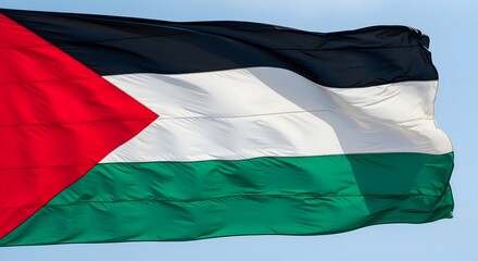 Obraz premium Palestinian Flag Waving Proudly in Sky