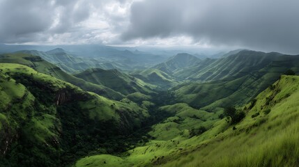 Awesome photo of panoramic view of lush green hills and valleys under a cloudy sky.