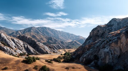 Obraz premium Expansive mountain valley under a clear sky.