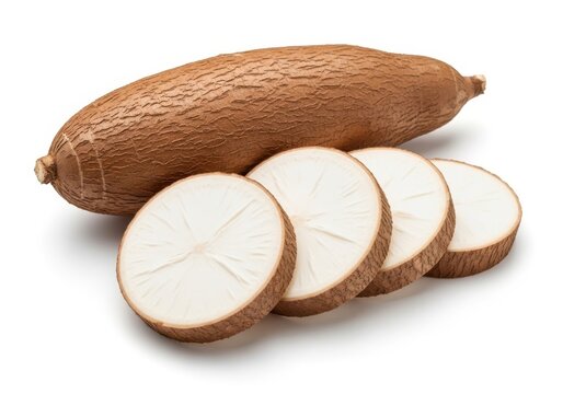 Whole unpeeled cassava root with four cross-section slices on white yuca manioc