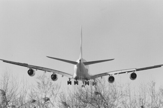 Rear view of airplane landing approach