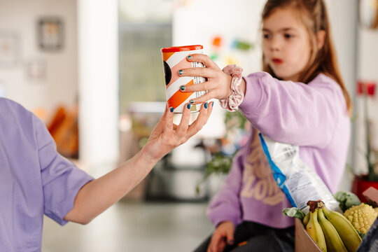 Close-up on exchanging grocery item