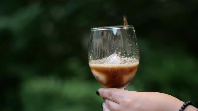 coke being poured into a glass