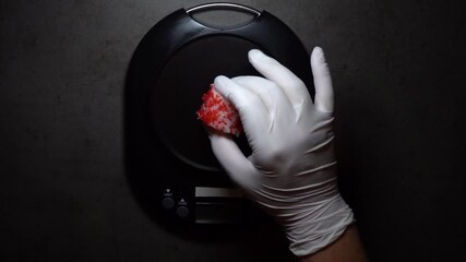 Chef places sushi on digital scale to check precise weight, symbolizing quality control, accuracy, and the discipline of professional Japanese culinary standards.