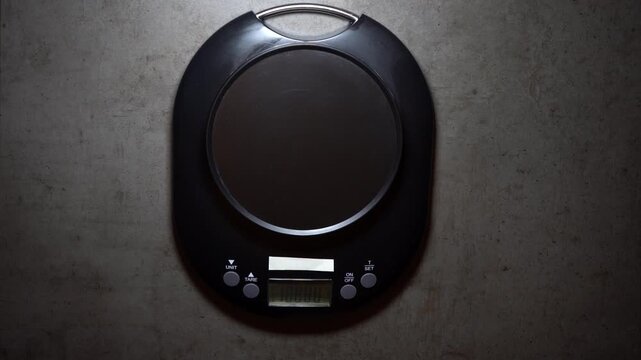 Chef places sushi on digital scale to check precise weight, symbolizing quality control, accuracy, and the discipline of professional Japanese culinary standards.