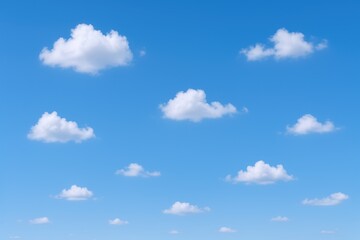 Fluffy White Clouds Scattered Across a Clear Blue Sky - Serene Weather Background Image