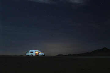 Van parked under night sky.