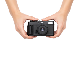 Photo of close up of a vintage camera held in two hands against a clean transparent background in studio