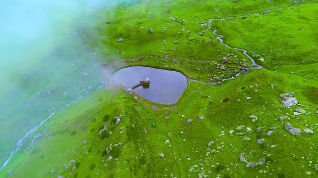 Stunning Top-View Drone Shot of Yulla Kanda Temple in the Himalayas with clouds