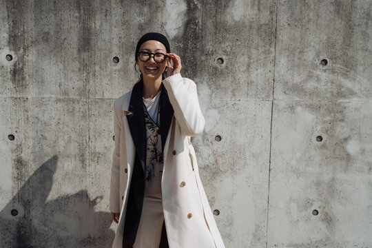 a single woman walks around a big city