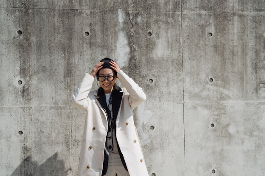 a single woman walks around a big city