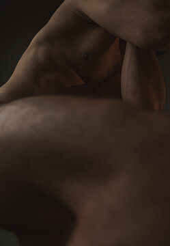 Sensual nude male torso with folded Body Part