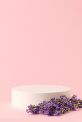 Beauty Cosmetics Product Presentation Scene made with White Round Podium and Lavender Flowers on Pink Background