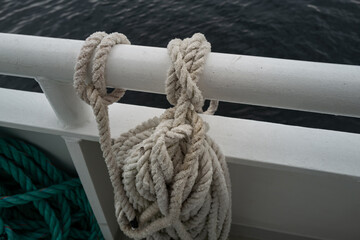 neatly coiled mooring rope on a boat