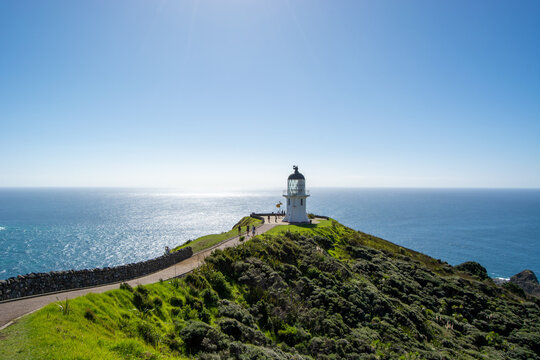 Lighthouse on a Hill Overlooking the Ocean
