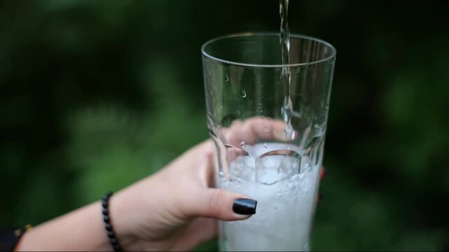 sparkling water being poured into a glass