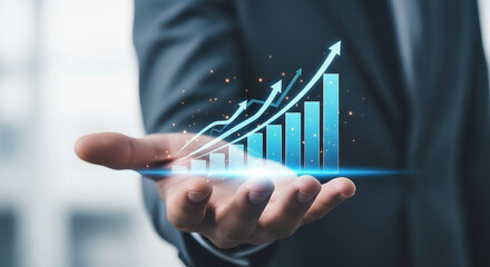 Hand holding glowing blue financial growth bar chart with arrows finance graph