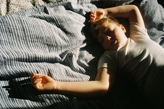 A kid asleep in a day time