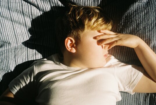 A kid asleep in his bedroom