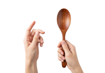 Photo of close up of a hand holding a wooden spoon on a transparent background perfect for cooking and food related content