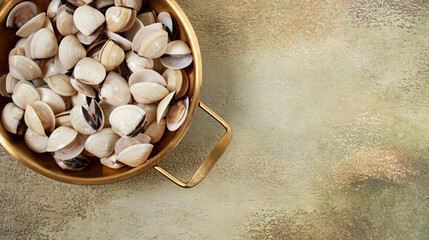 freshly frozen vongole clams, in a frying pan, top view, no people,