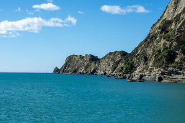 Serene Coastal Landscape with Rocky Cliffs and Turquoise Waters