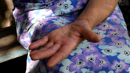 Aged wrinkled skin palm of hand closeup